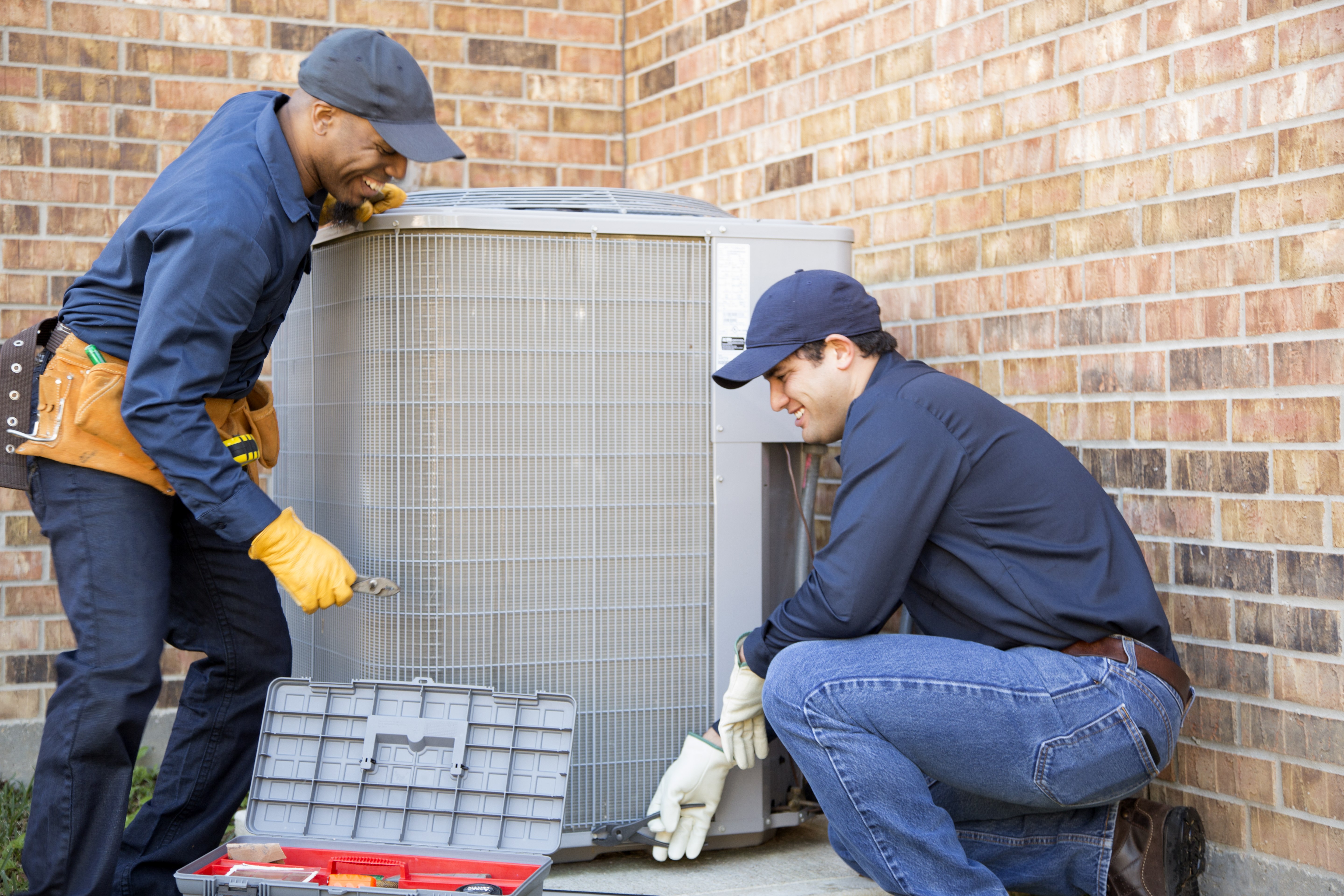 HVAC techs installing AC