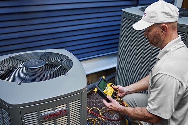 HVAC Technician Inspects Unit After AC Installation in Kennesaw, GA