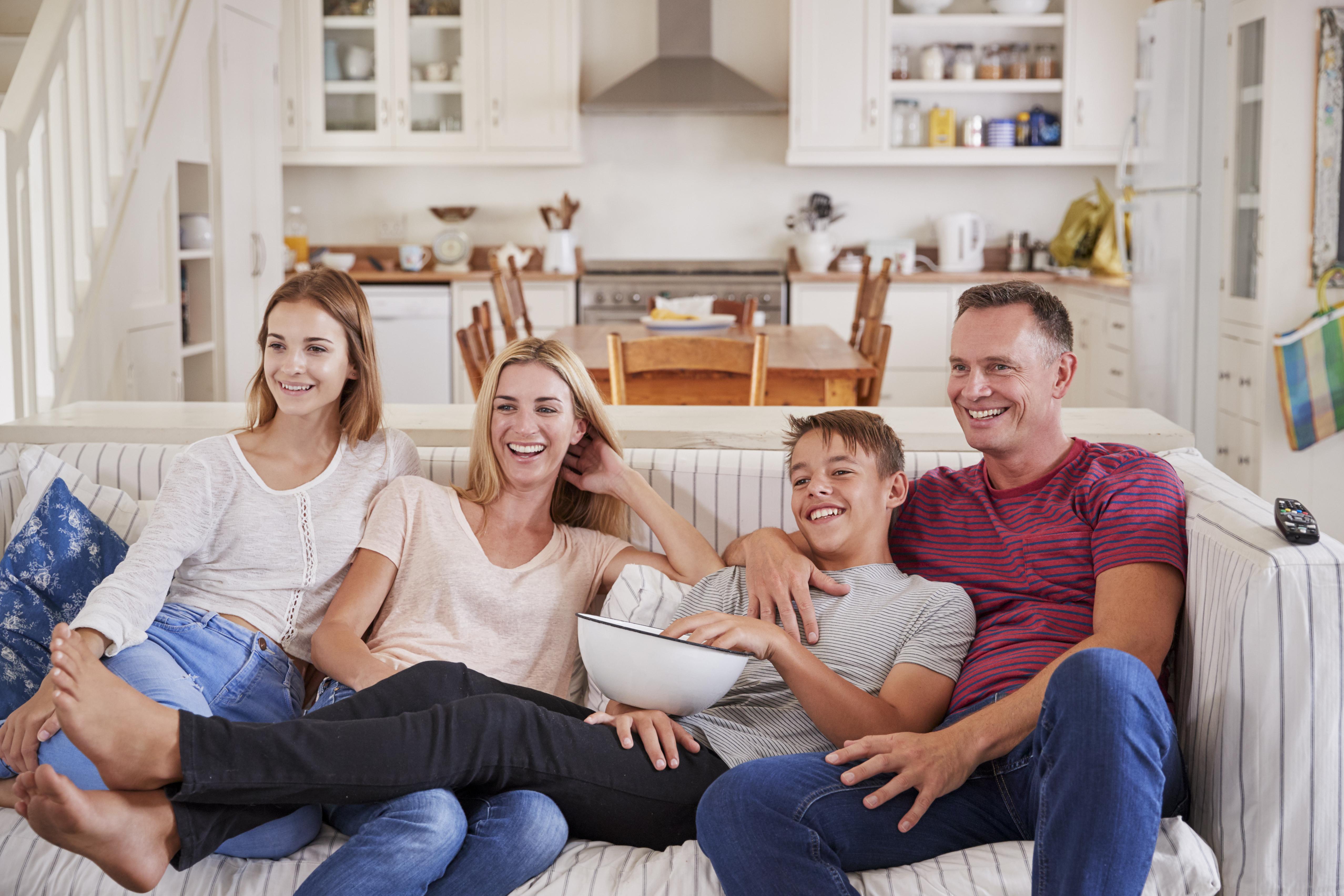 Family on couch, open floor plan